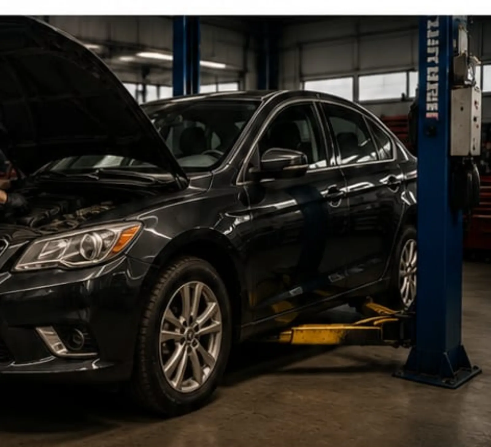 Technician servicing a vehicle at Northway Auto